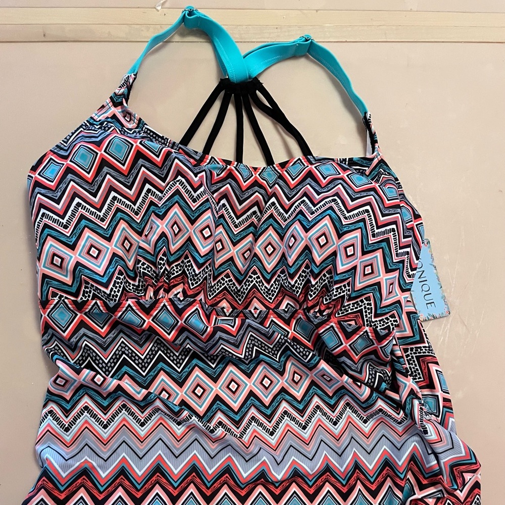Bathing suit top, mixed colors, never worn, tag still attached in photo.